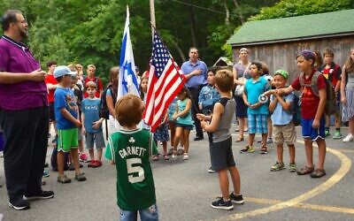 Scott Sokol, head of school at MetroWest Jewish Day School in Framingham, Massachusetts, leading morning circle, in 2019.  (Courtesy of MWJDS)