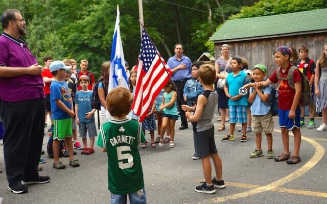Scott Sokol, head of school at MetroWest Jewish Day School in Framingham, Massachusetts, leading morning circle, in 2019. (Courtesy of MWJDS) Scott Sokol, head of school at MetroWest Jewish Day School in Framingham, Massachusetts, leading morning circle, in 2019. (Courtesy of MWJDS)