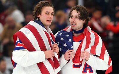Jack Hughes #86 and Quinn Hughes #43 of Team United States celebrate winning the gold medals after the team’s 2-1 overtime victory in the Men’s Gold Medal match between Canada and the United States of the 2026 Winter Olympic games in Milan, Feb. 22, 2026. (Gregory Shamus/Getty Images)