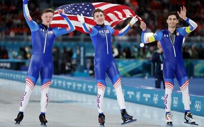 (L-R) Ethan Cepuran, Casey Dawson and Emery Lehman of Team United States celebrate after winning silver in the Speed Skating Men’s Team Pursuit on day eleven of the Milano Cortina 2026 Winter Olympic games at Milano Speed Skating Stadium on Feb. 17, 2026 in Milan. (Jamie Squire/Getty Images)