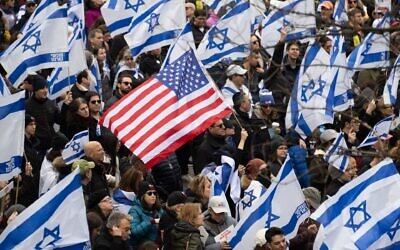 Demonstrators hold US and Israeli flags during a rally in Central Park marking 150 days since hostages were taken in attack on Israel on March 10, 2024 in New York City. (Noam Galai/Getty Images)