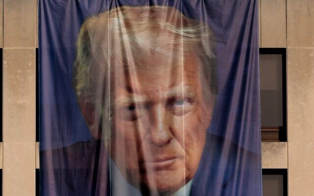Wind ruffles a giant banner with the image of President Donald Trump hanging on the outside of the U.S. Department of Labor on Jan. 05, 2026 in Washington, DC. (Chip Somodevilla/Getty Images)