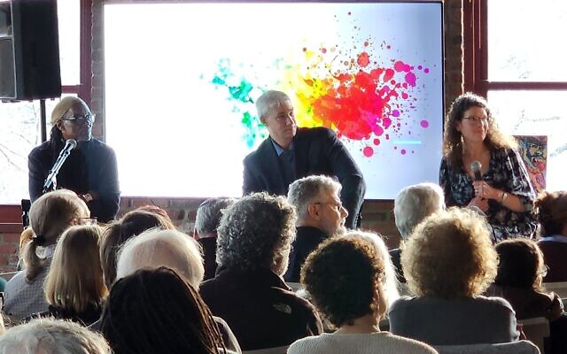 Rev. Tim Smith, Avi Dresner and Emily Loeb listen to attendees during a March 19 program in Hazelwood. (Photo by Adam Reinherz)