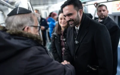 New York City Mayor Zohran Mamdani shakes hands with a Jewish man aboard the subway to Grand Army to sign an executive order establishing the Mayor’s Office of Mass Engagement, Jan. 2, 2026. (Credit: Michael Appleton/Mayoral Photography Office)