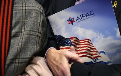 A visitor holds an AIPAC folder in an elevator in Rayburn House Office Building on March 12, 2024 on Capitol Hill in Washington, DC. (Alex Wong/Getty Images)