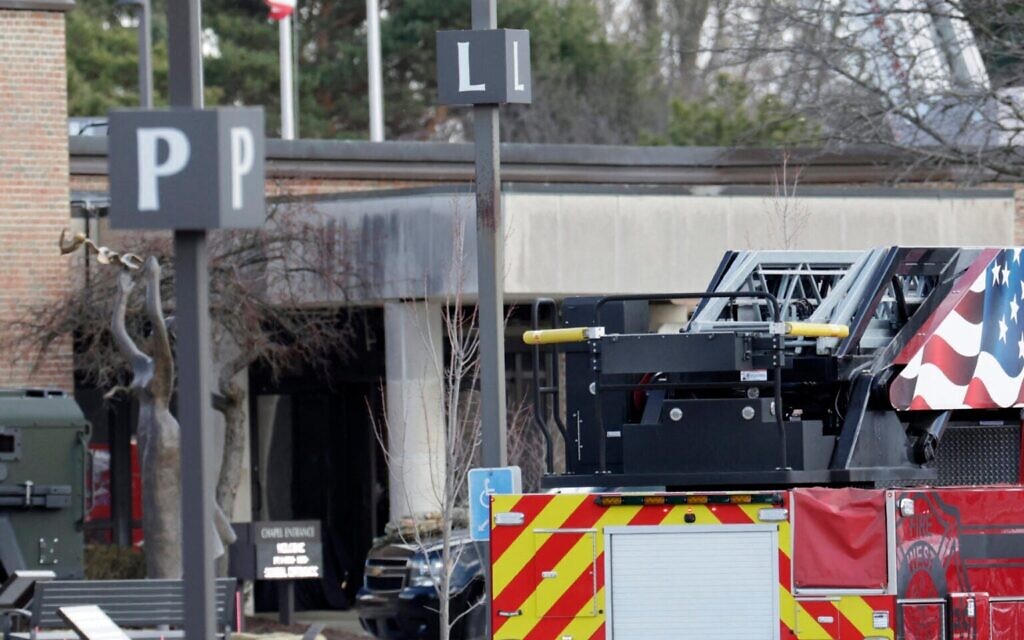 Law enforcement remain on site at the Temple Israel synagogue in West Bloomfield, Michigan, a Detroit suburb, on March 12, 2026, after an assailant drove a vehicle into the building. (Photo by Jeff Kowalsky/AFP via Getty Images)