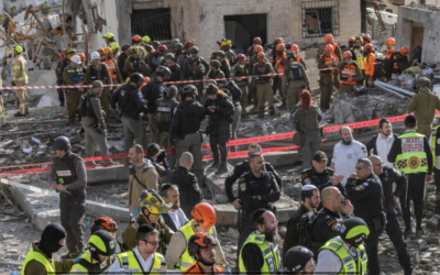 Israeli security and rescue forces operate at the scene where a ballistic missile fired from Iran struck Beit Shemesh, central Israel, causing extensive destruction and killing at least nine people, March 1, 2026. (Yonatan Sindel/Flash90)
