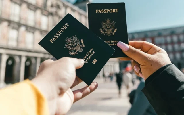 Two people holding up U.S. passports (Credit: Spencer Davis/Pexels) Two people holding up U.S. passports (Credit: Spencer Davis/Pexels)