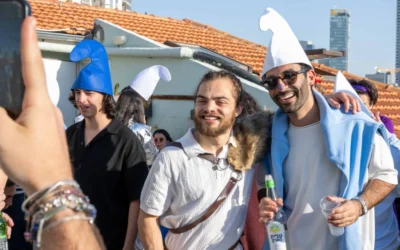 People dressed in costume pose for photos during Purim celebrations in central Israel, March 3, 2026. (Photo by Matt Kaminsky/JNS)