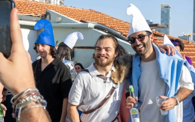 People dressed in costume pose for photos during Purim celebrations in central Israel, March 3, 2026. (Photo by Matt Kaminsky/JNS) People dressed in costume pose for photos during Purim celebrations in central Israel, March 3, 2026. (Photo by Matt Kaminsky/JNS)