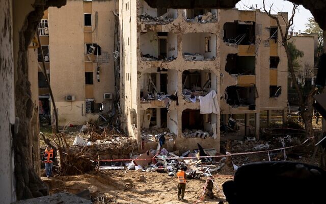 An emergency responder stands near destroyed buildings after an Iranian missile strike on March 22, 2026 in Arad, Israel. Iran has continued firing waves of drones and missiles at Israel after the United States and Israel launched a joint attack on Iran early on February 28th. (Amir Levy/Getty Images) An emergency responder stands near destroyed buildings after an Iranian missile strike on March 22, 2026 in Arad, Israel. Iran has continued firing waves of drones and missiles at Israel after the United States and Israel launched a joint attack on Iran early on February 28th. (Amir Levy/Getty Images)