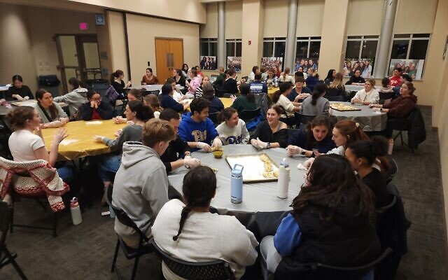 Students gather inside the Edward and Rose Berman Hillel-Jewish University Center building. (Photo by Adam Reinherz)