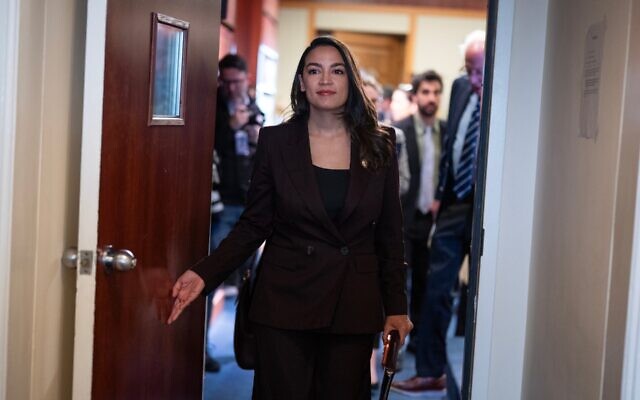 Rep. Alexandria Ocasio-Cortez, D-N.Y., and Sen. Bernie Sanders, I-Vt., conclude a news conference announcing the Artificial Intelligence Data Center Moratorium Act in the U.S. Capitol on Wednesday, March 25, 2026. The legislation aims to “ensure that AI benefits workers, is safe and effective and does not harm communities or destroy the environment." (Tom Williams/CQ Roll Call) Rep. Alexandria Ocasio-Cortez, D-N.Y., and Sen. Bernie Sanders, I-Vt., conclude a news conference announcing the Artificial Intelligence Data Center Moratorium Act in the U.S. Capitol on Wednesday, March 25, 2026. The legislation aims to “ensure that AI benefits workers, is safe and effective and does not harm communities or destroy the environment." (Tom Williams/CQ Roll Call)