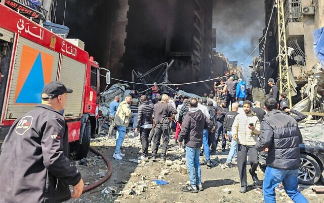 First responders and residents stand amid rubble at the site of an Israeli airstrike in Beirut's Corniche al-Mazraa neighborhood on April 8, 2026. (Photo by AFP via Getty Images) First responders and residents stand amid rubble at the site of an Israeli airstrike in Beirut's Corniche al-Mazraa neighborhood on April 8, 2026. (Photo by AFP via Getty Images)