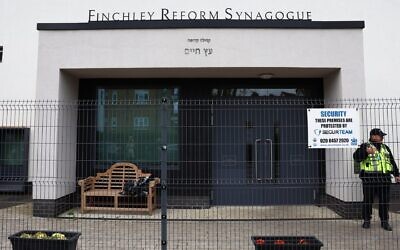 A security guard stands on duty outside Finchley Reform Synagogue, in the North Finchley area of north London, on April 15, 2026, following an attack on the synagogue in the early hours of the morning. (Toby Shepheard / AFP via Getty Images)