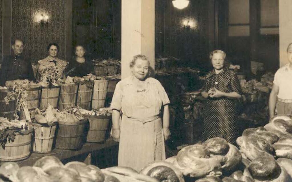 In its heyday in the 1930s, the Lechem Aniyum Society gathered weekly in the old Beth Jacob synagogue to prepare some 200 boxes of food for local delivery. (Image courtesy Rauh Jewish Archives)