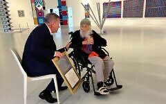 >

Pioneering kinetic artist Yaacov Agam receiving the Israel Prize from Education Minister Yoav Kisch on April 20, 2026 at the Yaacov Agam Museum of Art (Jessica Steinberg/Times of Israel)