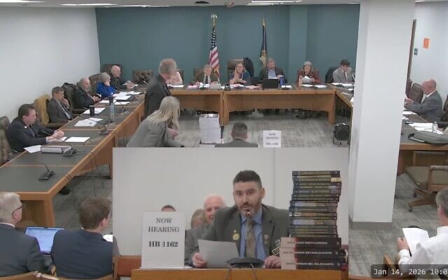New Hampshire GOP state Rep. Matt Sabourin dit Choinière (center) testifies before a state committee on his proposed amendment to add a Holocaust denier to the state's Holocaust education commission, Jan. 14, 2026. He is flanked by a stack of Holocaust-denial books. (Screenshot) New Hampshire GOP state Rep. Matt Sabourin dit Choinière (center) testifies before a state committee on his proposed amendment to add a Holocaust denier to the state's Holocaust education commission, Jan. 14, 2026. He is flanked by a stack of Holocaust-denial books. (Screenshot)