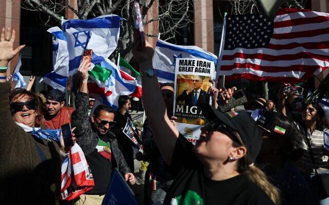 Iranian Americans wave flags and chant during a gathering of Iranian community members showing support for Israel and the United States, outside the Consulate General of Israel in Los Angeles, on March 5, 2026. (Patrick T. Fallon / AFP via Getty Images) Iranian Americans wave flags and chant during a gathering of Iranian community members showing support for Israel and the United States, outside the Consulate General of Israel in Los Angeles, on March 5, 2026. (Patrick T. Fallon / AFP via Getty Images)