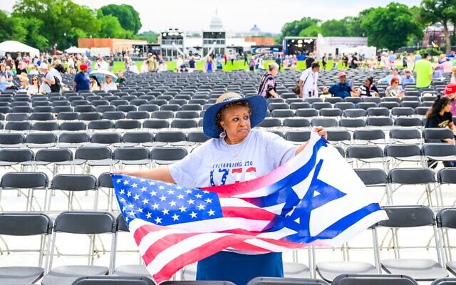 A woman holds a combination American-Israeli flags during Rededicate 250: A National Jubilee Of Prayer, Praise & Thanksgiving on the National Mall on May 17, 2026 in Washington, DC. (Pete Kiehart for The Washington Post via Getty Images) A woman holds a combination American-Israeli flags during Rededicate 250: A National Jubilee Of Prayer, Praise & Thanksgiving on the National Mall on May 17, 2026 in Washington, DC. (Pete Kiehart for The Washington Post via Getty Images)