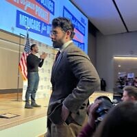 Hasan Piker looks on as U.S. Senate candidate Abdul El-Sayed delivers a stump speech in Ann Arbor, Michigan, April 7, 2026. Piker, a popular Twitch streamer accused of antisemitism, prompted controversy for campaigning with El-Sayed. (Andrew Lapin/JTA)