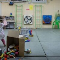 Children play in a public bomb shelter in the Nahlaot neighborhood of central Jerusalem, June 8, 2026. (Chaim Goldberg/Flash90)