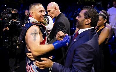 Justin Gaethje and FBI Director Kash Patel shake hands during the UFC Freedom 250 event on the South Lawn of the White House on June 14, 2026 in Washington, D.C. (Michelle Farsi/Zuffa LLC)