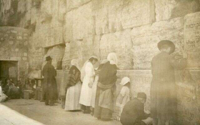 Abraham Orkin Freedman's photograph of the Western Wall from 1921 showed men and women praying together at the Jewish holy site. (Courtesy Tower of David Jerusalem Museum)