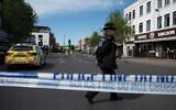 British police investigate the scene after two people were injured in a stabbing attack in the Golders Green area of north London on April 29, 2026. (Rasid Necati Aslim/Anadolu via Getty Images)