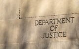 The  lettering on the side of the Justice Department headquarters building in Washington, DC. (Photo by Greggory DiSalvo via iStock)