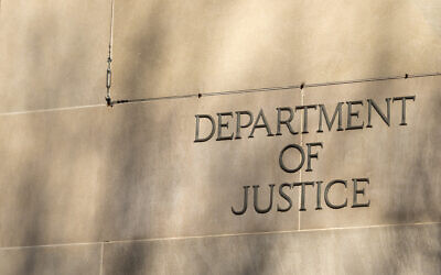 The  lettering on the side of the Justice Department headquarters building in Washington, DC. (Photo by Greggory DiSalvo via iStock)