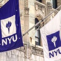 Two NYU flags flying above entrance to Frederick Loewe Theatre on New York University campus. (Plexi Images/GHI/UCG/Universal Images Group via Getty Images)