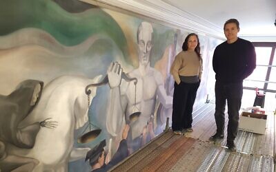 Conservationists Chantal Bernicky and Noah Emhurt stand beside "Justice." (Photo by Adam Reinherz)