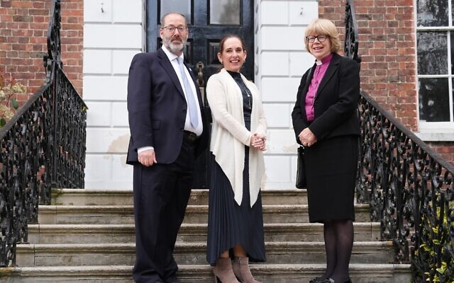 May 14, 2026. LONDON. Archbishop of Canterbury Dame Sarah Mullally is greeted by Rabbi Charley Baginsky (center) and Rabbi Josh Levy as she arrives for a visit to the to Sternberg Centre to meet with the Jewish community in Finchley in a demonstration of solidarity following the recent antisemitic attacks in London. (Jonathan Brady/PA Images via Getty Images)