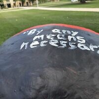 Eight Carnegie Mellon University students are being investigated for recent messages painted on its fence. Messages like "By any means necessary," have forced the university to act several times since June. (Photo by David Rullo) 