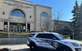 A Shomrim Toronto Jewish Safety Patrol vehicle is parked under police tape outside the Beth Avraham Yoseph of Toronto (BAYT) synagogue following gunshots fired at the building in Vaughan, Ontario, Canada, on April 9, 2026. (Creative Touch Imaging Ltd./NurPhoto)