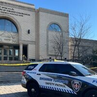 A Shomrim Toronto Jewish Safety Patrol vehicle is parked under police tape outside the Beth Avraham Yoseph of Toronto (BAYT) synagogue following gunshots fired at the building in Vaughan, Ontario, Canada, on April 9, 2026. (Creative Touch Imaging Ltd./NurPhoto)