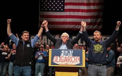Sen. Bernie Sanders (center) stands with Troy Jackson (left), who is now running for the Democratic nomination for U.S. Senate, and  Graham Platner (right), who was then the Democrats' presumptive nominee, during Sanders' “Fighting Oligarchy” tour, May 24, 2026, in Orono, Maine. (Joe Raedle/Getty Images)