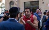 Haredi Orthodox and secular protesters and counter protesters face off outside a Jerusalem cafe open on Shabbat, Aug. 9, 2026 (Theia Chatelle)
