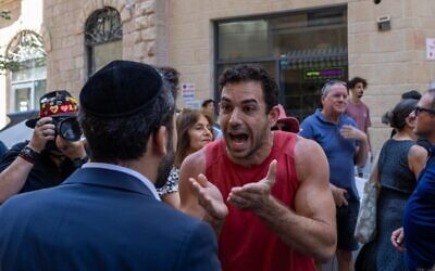 Haredi Orthodox and secular protesters and counter protesters face off outside a Jerusalem cafe open on Shabbat, Aug. 9, 2026 (Theia Chatelle)