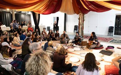 Attendees at the Big Jewish Gathering sit on meditation cushions during a session. Photo by Santiago Felipe for the Big Jewish Gathering