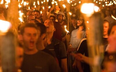 Neo-Nazis and white supremacists take part in a march the night before the Unite the Right rally in Charlottesville, Va., Aug. 11, 2017. (Zach D Roberts/NurPhoto via Getty Images)