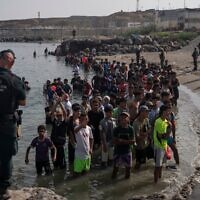 Migrants arrive on Tarajal beach after crossing the border between Spain and Morocco on July 31, 2026 in Ceuta, Spain. (Adri Salido/Getty Images)