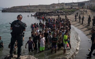 Migrants arrive on Tarajal beach after crossing the border between Spain and Morocco on July 31, 2026 in Ceuta, Spain. (Adri Salido/Getty Images)