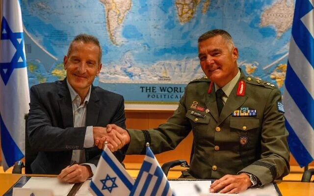 Defense Ministry Director General Amir Baram (left) and his Greek counterpart, Ioannis Bouras,  sign a sale of Israeli systems to Greece, August 31, 2026. (Defense Ministry)