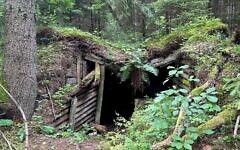 A partisan bunker is seen in Rūdninkai Forest. (Photo by Shira Li Bartov)