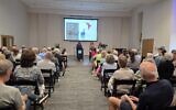 Jo Recht addresses those attending a town hall to learn more about the Tree of Life. She's joined by Diane Rosenthal and 10.27 Healing Partnership Executive Director Maggie Feinstein. (Photo by David Rull)