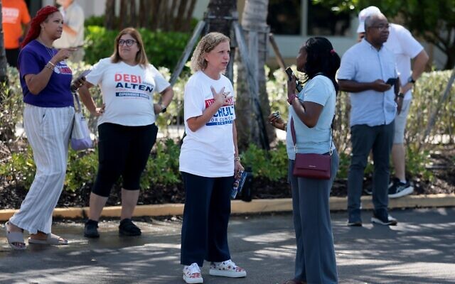 Rep. Debbie Wasserman Schultz (D-FL) speaks with voter Sandra Woodburn as she campaigns outside of the Kings Point Clubhouse polling station on August 18, 2026, in Tamarac, Florida. (Joe Raedle/Getty Images)