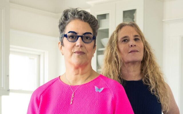 Jan Reicher (left) and Debbie Findling, former Wexner Heritage Program fellows who are giving the amount the program spent on them and encouraging former fellows to pay similar amounts to organizations supporting victims of sexual assault and human trafficking, pose for a photograph in Findling’s home, May 14, 2026. (Aaron Levy-Wolins/J. The Jewish News of Northern California)