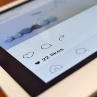 Close-up of a tablet showing a social media post (Credit: Pixabay)